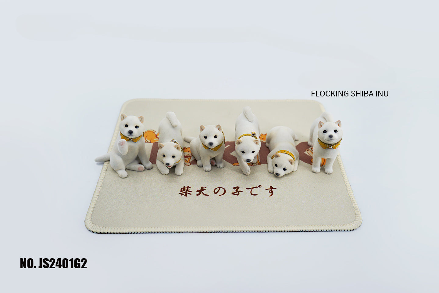 A set of three flocking Shiba Inu dog models in different colors - black, white, and tan. Each model features a realistic and adorable design with a collar in different colors: blue, yellow, and red. The dogs are shown in various poses, including waving, standing, and sitting.