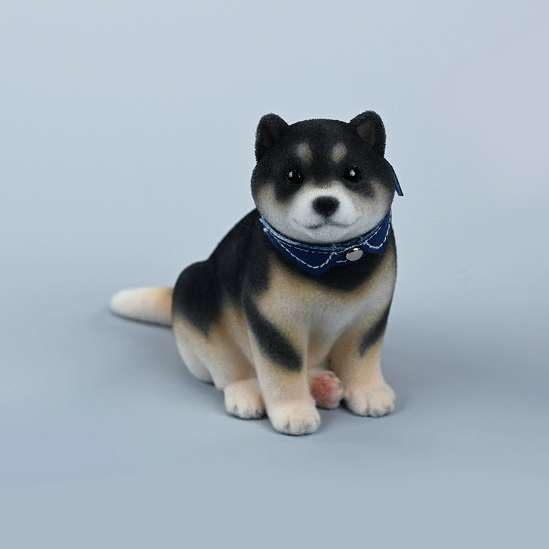 A set of three flocking Shiba Inu dog models in different colors - black, white, and tan. Each model features a realistic and adorable design with a collar in different colors: blue, yellow, and red. The dogs are shown in various poses, including waving, standing, and sitting.