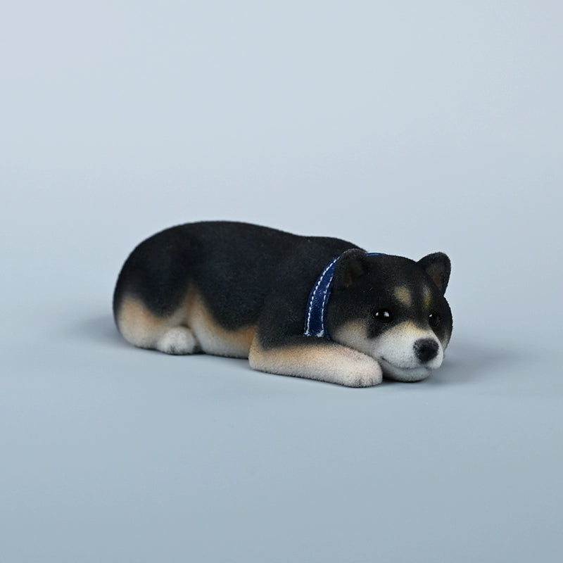 A set of three flocking Shiba Inu dog models in different colors - black, white, and tan. Each model features a realistic and adorable design with a collar in different colors: blue, yellow, and red. The dogs are shown in various poses, including waving, standing, and sitting.