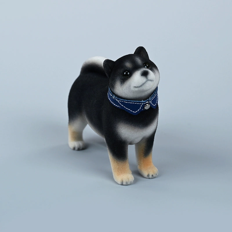 A set of three flocking Shiba Inu dog models in different colors - black, white, and tan. Each model features a realistic and adorable design with a collar in different colors: blue, yellow, and red. The dogs are shown in various poses, including waving, standing, and sitting.