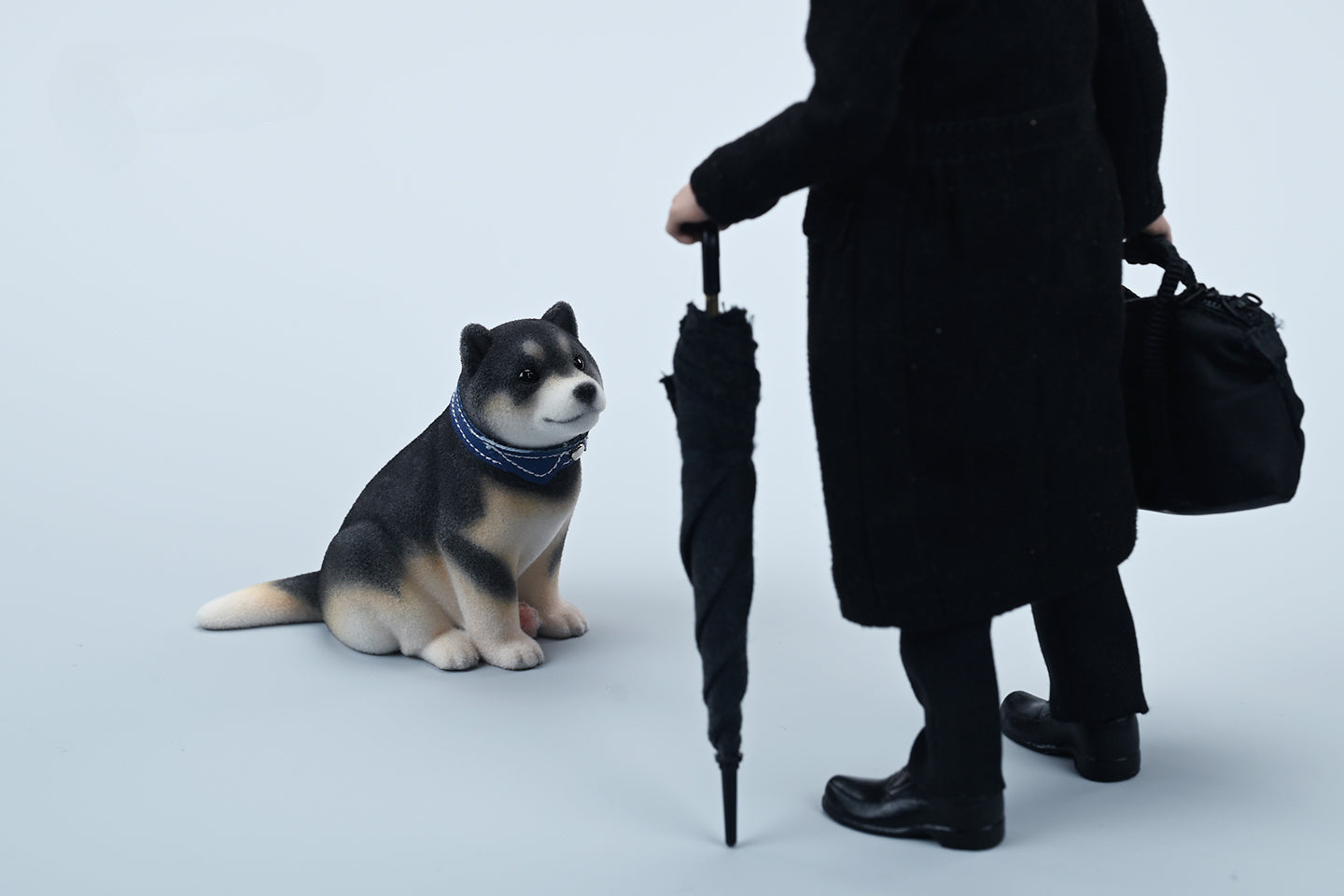 A set of three flocking Shiba Inu dog models in different colors - black, white, and tan. Each model features a realistic and adorable design with a collar in different colors: blue, yellow, and red. The dogs are shown in various poses, including waving, standing, and sitting.