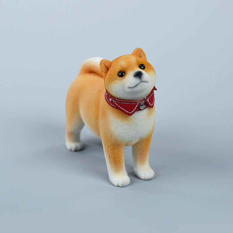 A set of three flocking Shiba Inu dog models in different colors - black, white, and tan. Each model features a realistic and adorable design with a collar in different colors: blue, yellow, and red. The dogs are shown in various poses, including waving, standing, and sitting.