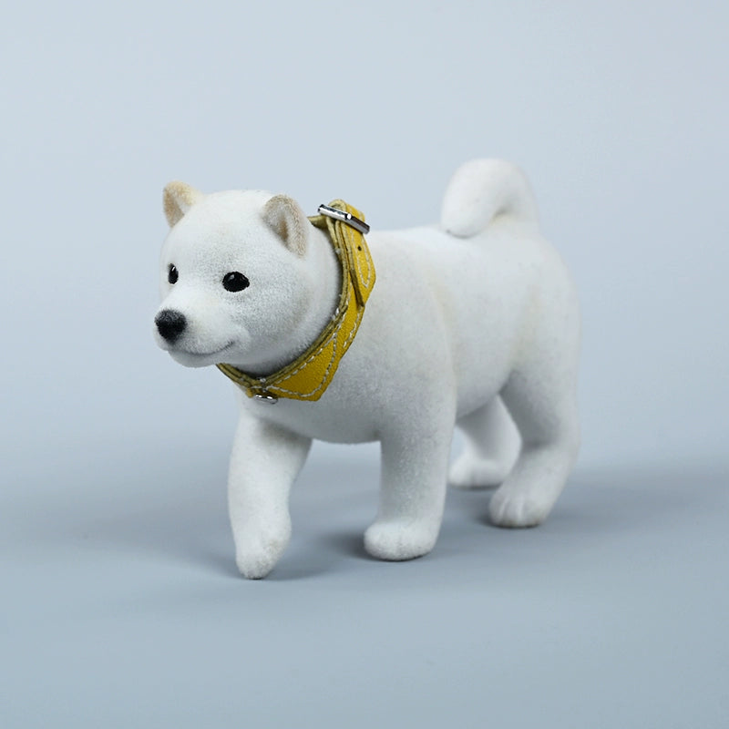 A set of three flocking Shiba Inu dog models in different colors - black, white, and tan. Each model features a realistic and adorable design with a collar in different colors: blue, yellow, and red. The dogs are shown in various poses, including waving, standing, and sitting.