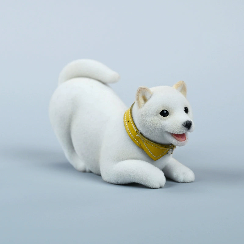 A set of three flocking Shiba Inu dog models in different colors - black, white, and tan. Each model features a realistic and adorable design with a collar in different colors: blue, yellow, and red. The dogs are shown in various poses, including waving, standing, and sitting.