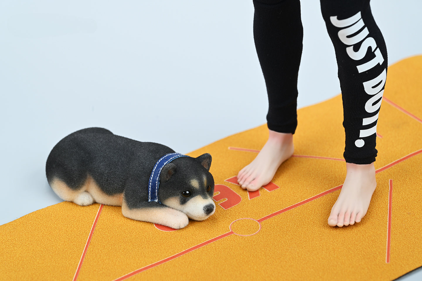 A set of three flocking Shiba Inu dog models in different colors - black, white, and tan. Each model features a realistic and adorable design with a collar in different colors: blue, yellow, and red. The dogs are shown in various poses, including waving, standing, and sitting.