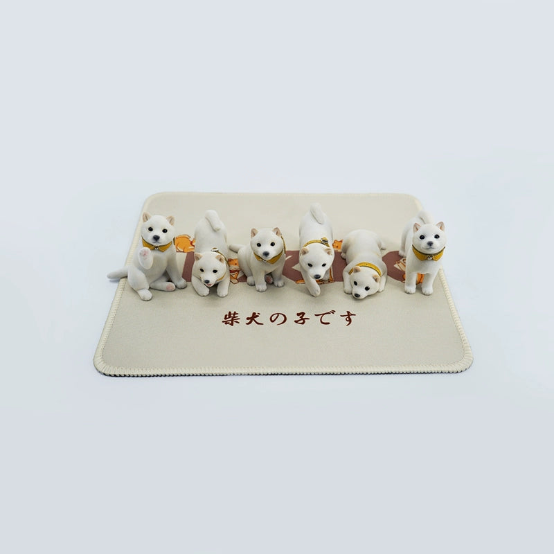 A set of three flocking Shiba Inu dog models in different colors - black, white, and tan. Each model features a realistic and adorable design with a collar in different colors: blue, yellow, and red. The dogs are shown in various poses, including waving, standing, and sitting.