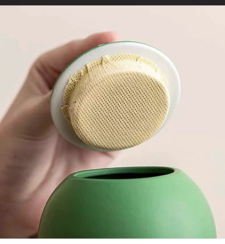 This green panda pet urn showcases a cute round ceramic design with a playful panda figurine on top, measuring 12.5cm wide, 11cm tall, and 9.1cm in diameter, holding 290ml of ashes. Ideal for North American pet owners honoring small pets like cats or dogs, it offers secure storage and a warm memorial display, fitting perfectly on shelves or mantels.