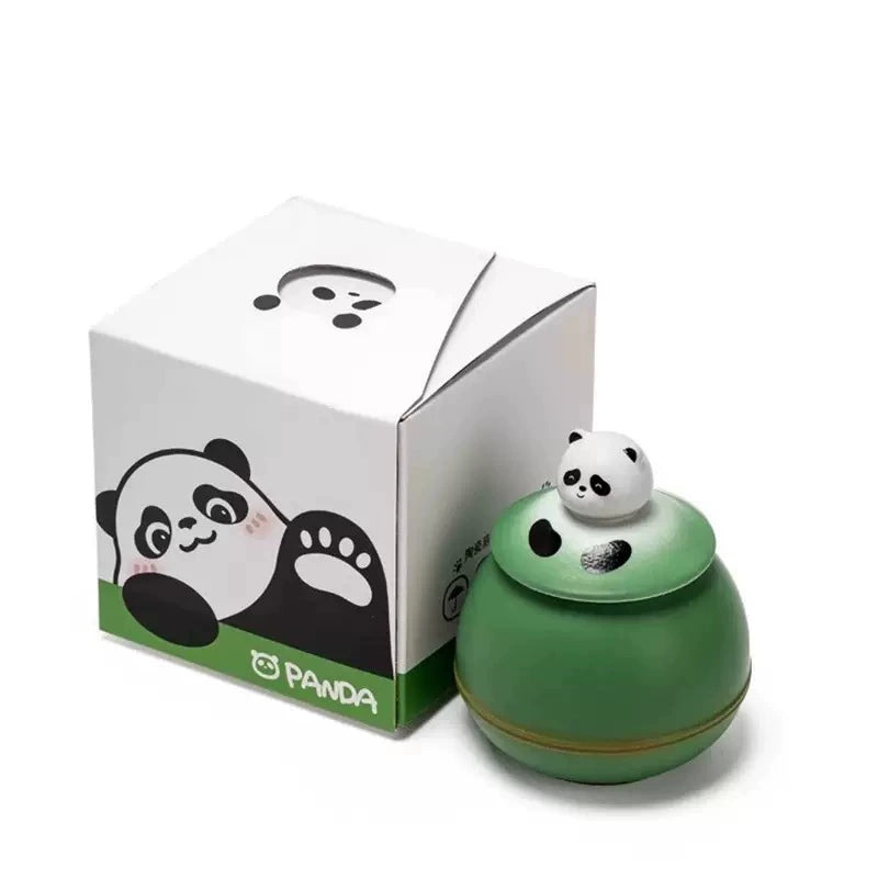 This green panda pet urn showcases a cute round ceramic design with a playful panda figurine on top, measuring 12.5cm wide, 11cm tall, and 9.1cm in diameter, holding 290ml of ashes. Ideal for North American pet owners honoring small pets like cats or dogs, it offers secure storage and a warm memorial display, fitting perfectly on shelves or mantels.