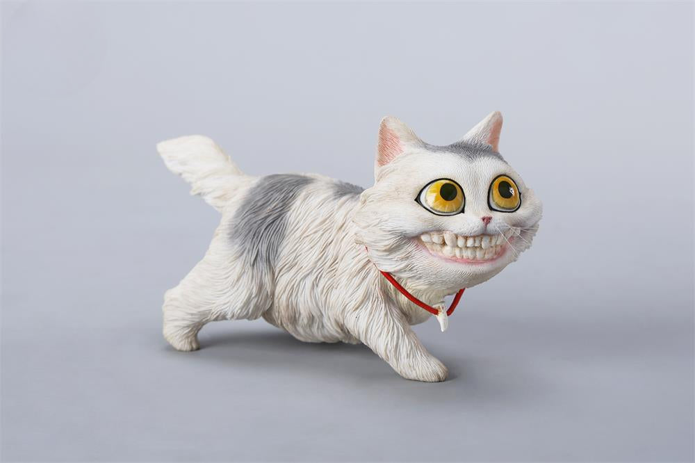 A highly detailed grinning cat resin figurine with expressive eyes, textured fur, and a wide smile. This unique decorative sculpture includes a bone pendant necklace and serves as a quirky, surreal home decor piece or collectible item for cat lovers and fantasy art fans.