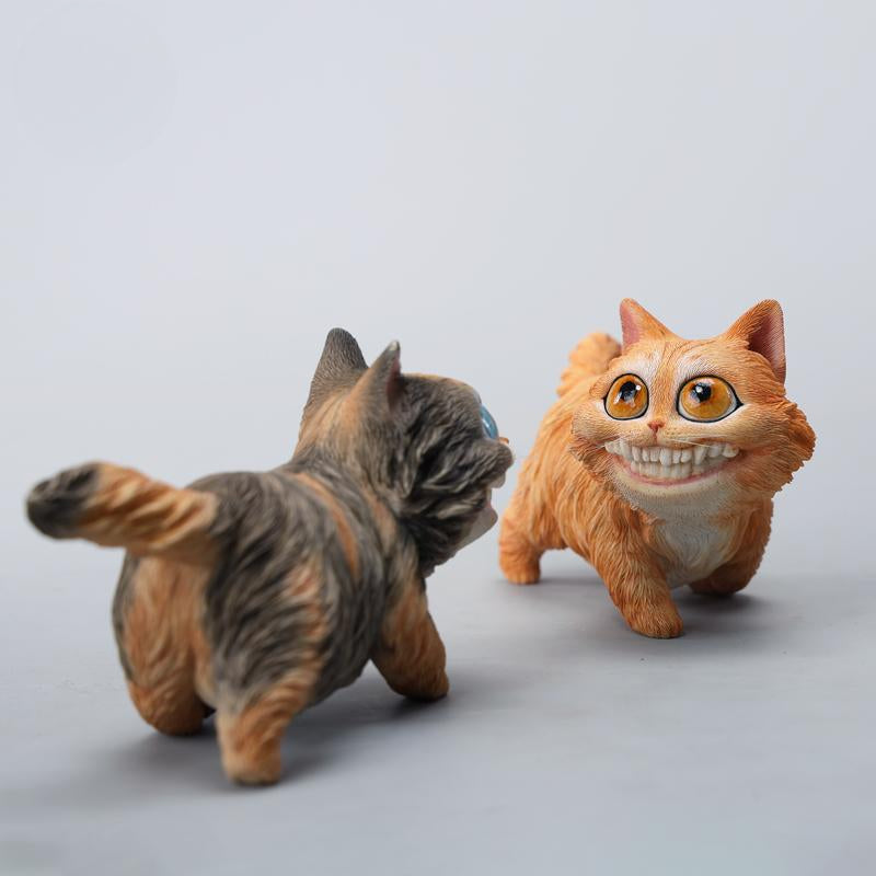A highly detailed grinning cat resin figurine with expressive eyes, textured fur, and a wide smile. This unique decorative sculpture includes a bone pendant necklace and serves as a quirky, surreal home decor piece or collectible item for cat lovers and fantasy art fans.