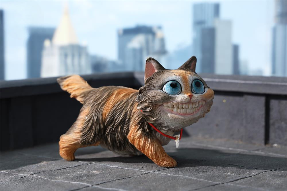 A highly detailed grinning cat resin figurine with expressive eyes, textured fur, and a wide smile. This unique decorative sculpture includes a bone pendant necklace and serves as a quirky, surreal home decor piece or collectible item for cat lovers and fantasy art fans.