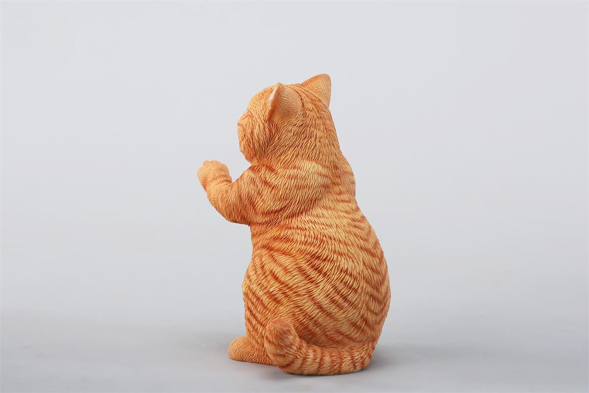 A lifelike string-playing cat figurine crafted from resin, featuring a realistic cat with expressive eyes playing a violin. The sculpture showcases intricate fur details and a beautifully designed musical instrument, making it an excellent collectible or home decor piece for cat lovers and music enthusiasts.