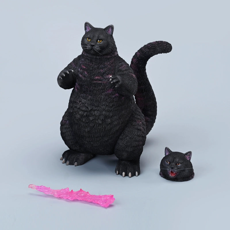 A set of two Meowzilla Cat figurines, one black and one orange, both designed with Godzilla-like scales on their backs. The black cat stands menacingly, while the orange cat is shown in a playful pose, surrounded by destroyed buildings. These resin models capture a whimsical fusion of cat and monster features, perfect for collectors and fans of unique decor.