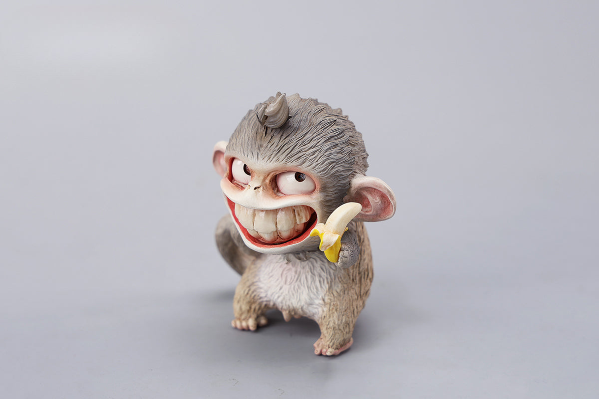 Hand-painted resin monkey figurine featuring a playful expression and banana. Collectible animal figurine with intricate detailing and high-quality craftsmanship. A must-have for monkey lovers, art collectors, and unique home décor enthusiasts.