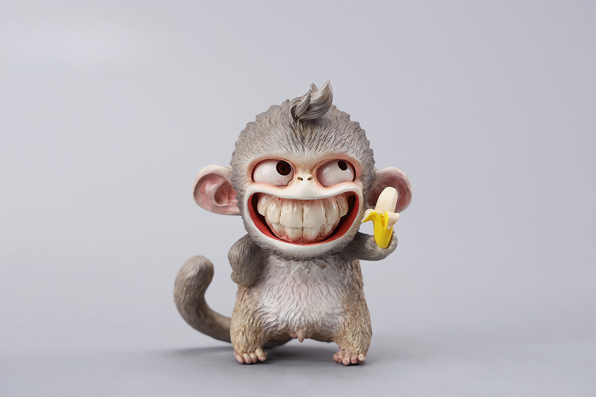 Hand-painted resin monkey figurine featuring a playful expression and banana. Collectible animal figurine with intricate detailing and high-quality craftsmanship. A must-have for monkey lovers, art collectors, and unique home décor enthusiasts.
