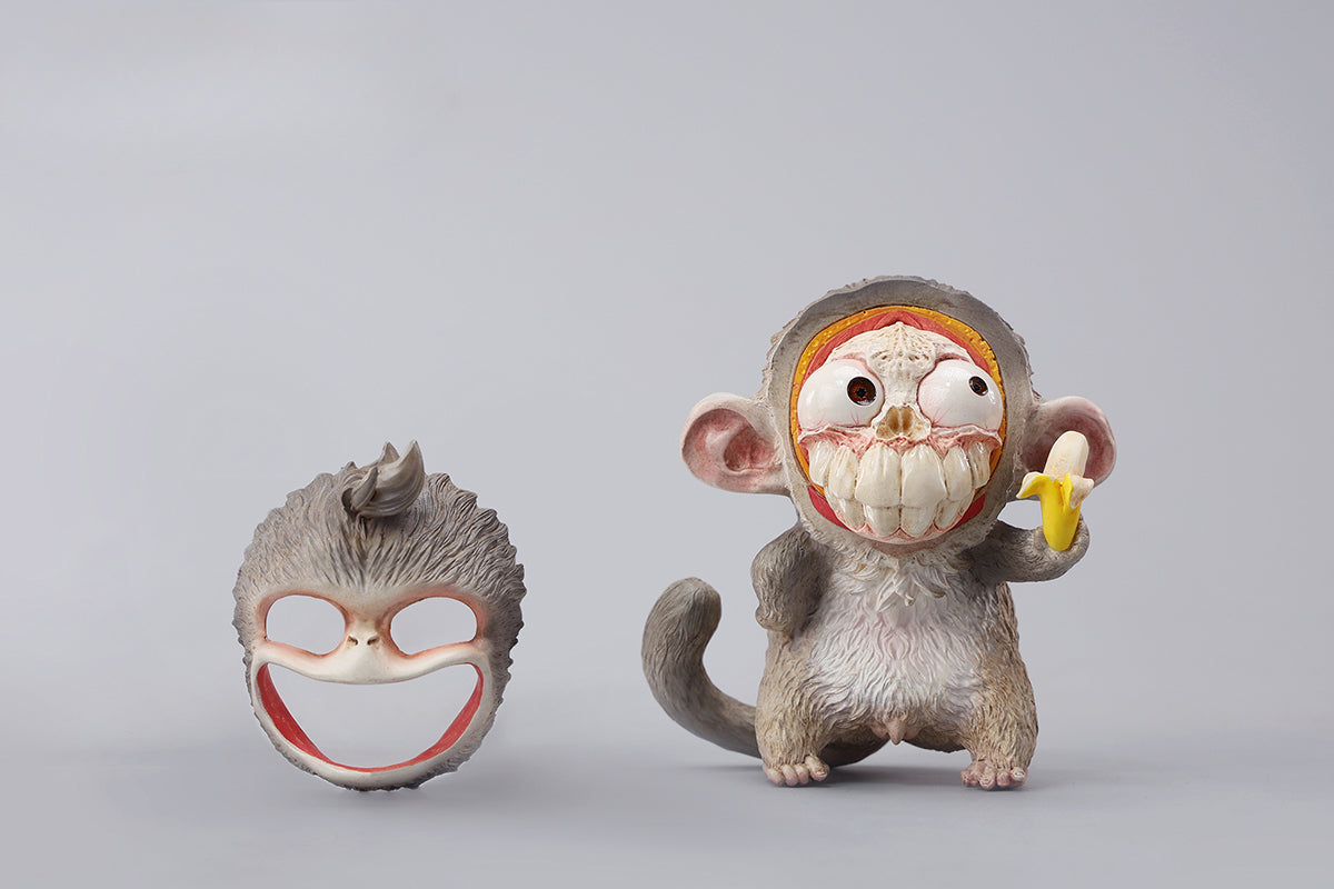 Hand-painted resin monkey figurine featuring a playful expression and banana. Collectible animal figurine with intricate detailing and high-quality craftsmanship. A must-have for monkey lovers, art collectors, and unique home décor enthusiasts.