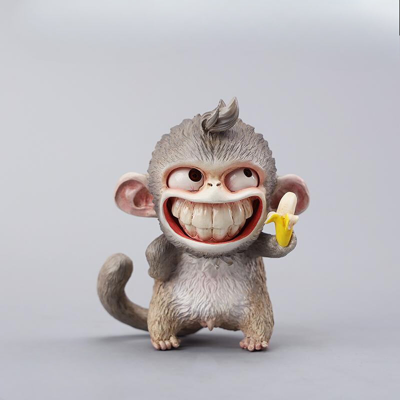 Hand-painted resin monkey figurine featuring a playful expression and banana. Collectible animal figurine with intricate detailing and high-quality craftsmanship. A must-have for monkey lovers, art collectors, and unique home décor enthusiasts.