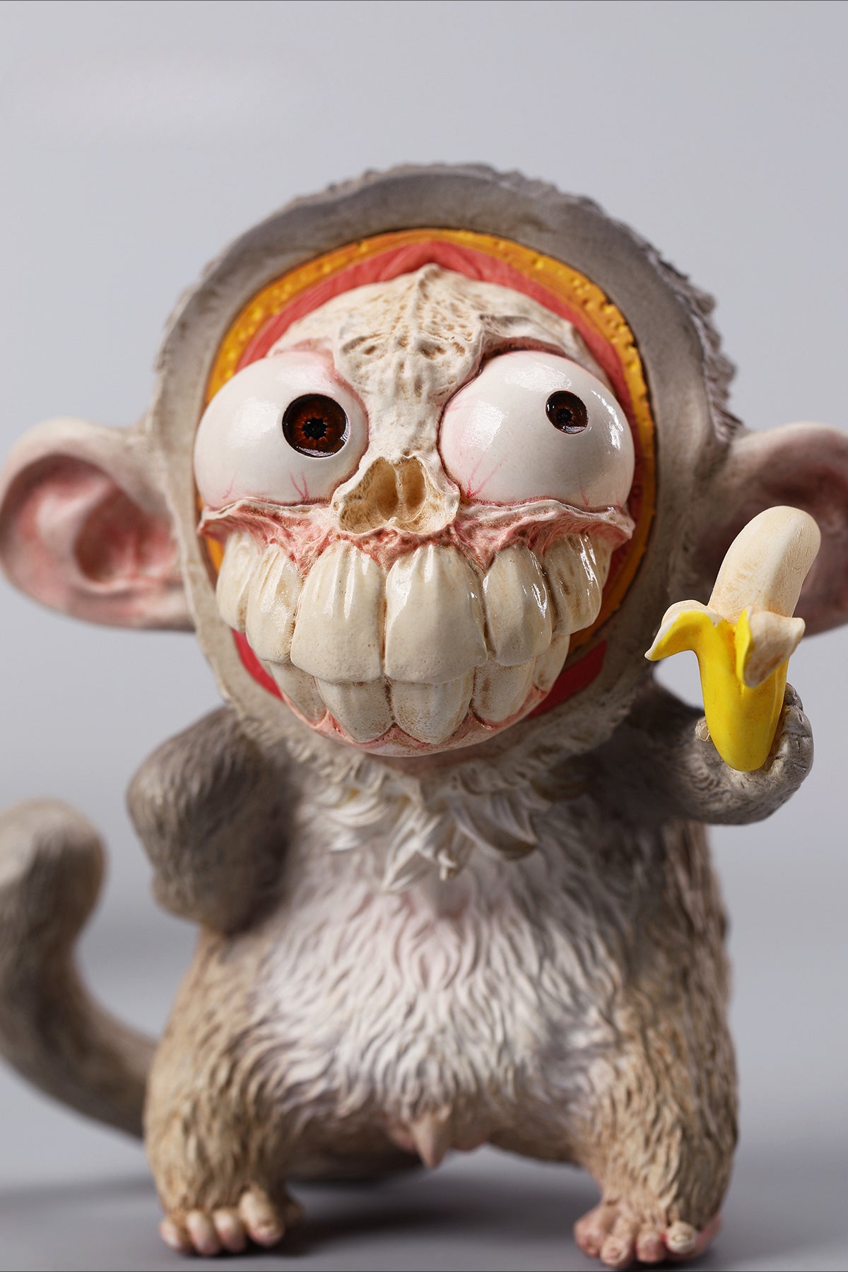 Hand-painted resin monkey figurine featuring a playful expression and banana. Collectible animal figurine with intricate detailing and high-quality craftsmanship. A must-have for monkey lovers, art collectors, and unique home décor enthusiasts.