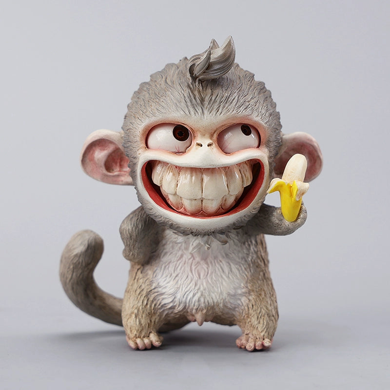 Hand-painted resin monkey figurine featuring a playful expression and banana. Collectible animal figurine with intricate detailing and high-quality craftsmanship. A must-have for monkey lovers, art collectors, and unique home décor enthusiasts.