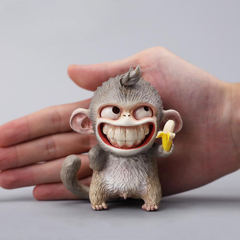 Hand-painted resin monkey figurine featuring a playful expression and banana. Collectible animal figurine with intricate detailing and high-quality craftsmanship. A must-have for monkey lovers, art collectors, and unique home décor enthusiasts.