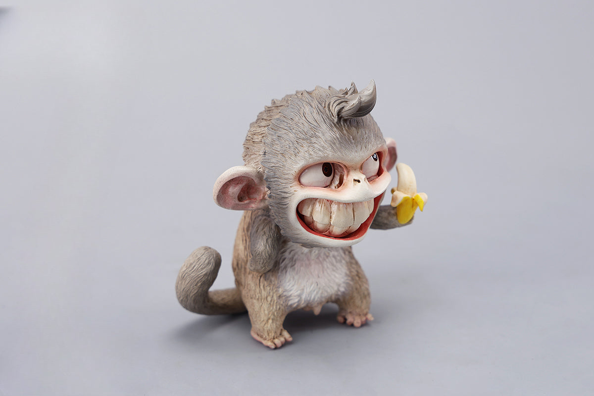 Hand-painted resin monkey figurine featuring a playful expression and banana. Collectible animal figurine with intricate detailing and high-quality craftsmanship. A must-have for monkey lovers, art collectors, and unique home décor enthusiasts.