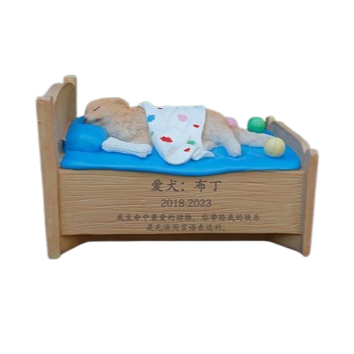 A beautifully designed cat bed tombstone featuring a peaceful cat resting in bed with yarn balls, personalized with the pet’s name and years. Made from eco-friendly resin for outdoor durability.