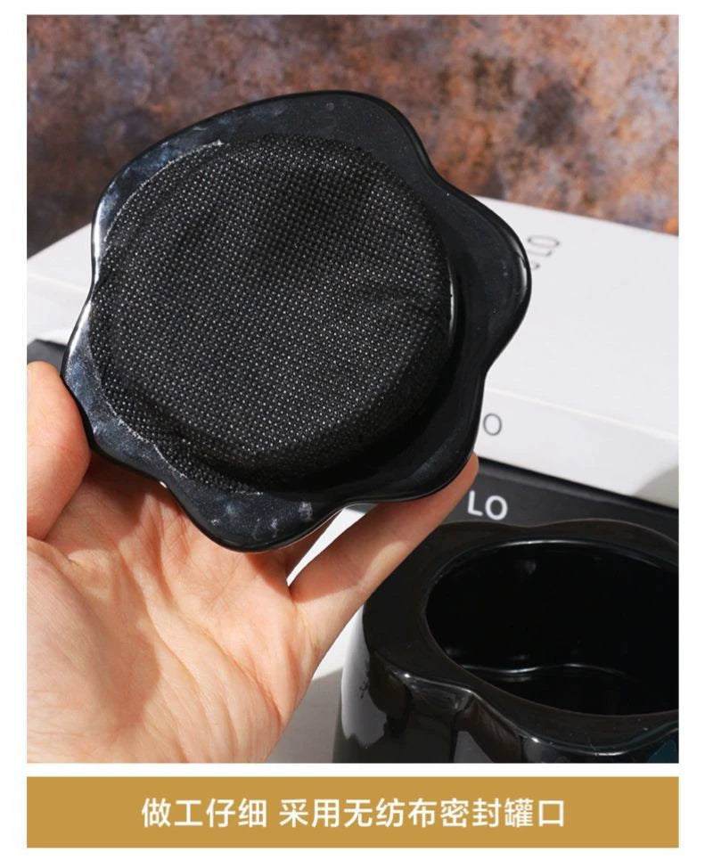 This pink and black paw ceramic pet urn features a stylish paw print lid, available in soft pink or sleek black, measuring approximately 12cm tall and 10cm wide. Crafted from durable ceramic, it offers secure storage for ashes of small to medium pets like cats or dogs, making it a heartfelt memorial display for North American pet owners on shelves or tables.