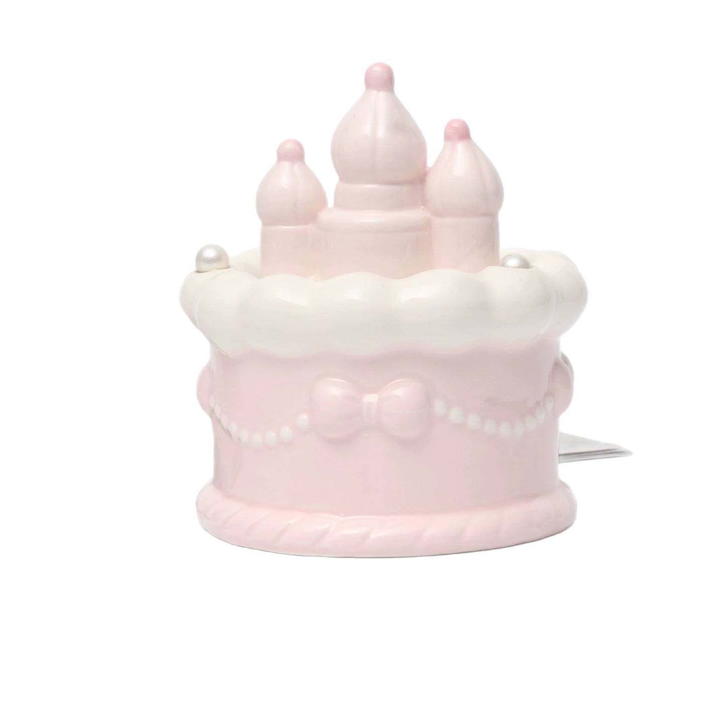 Three pastel pink ceramic pet cremation urns in bow and castle designs, displayed in varying sizes for cats and dogs, ideal for storing ashes securely while serving as a decorative and loving memorial in your home.