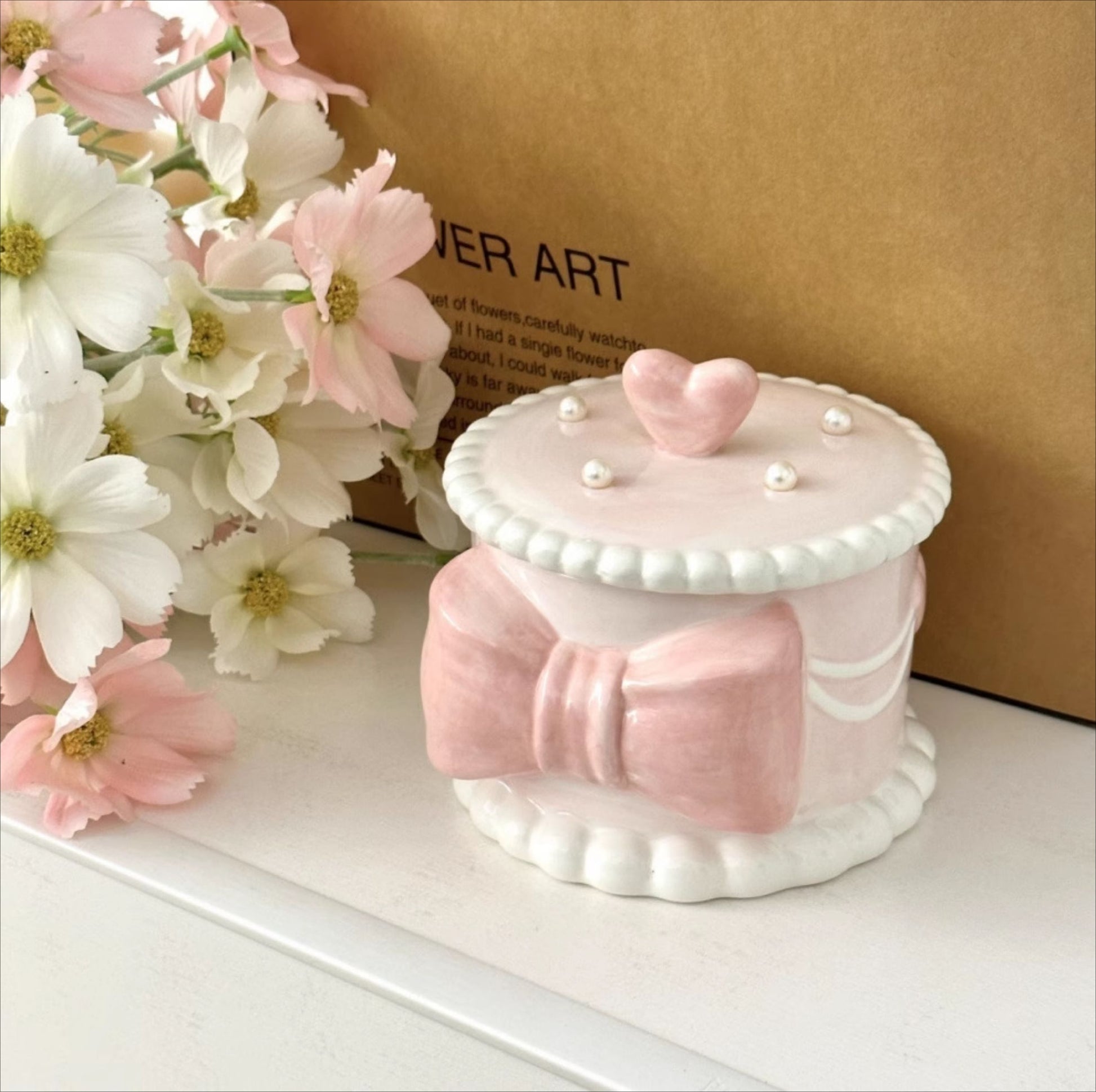 Pink Ceramic Round Pet Cremation Urn provides a secure and elegant way to store cat or dog ashes. With a smooth round design, soft pastel pink color, and durable ceramic craftsmanship, it’s perfect for home memorial display while keeping your pet’s memory safe and close.