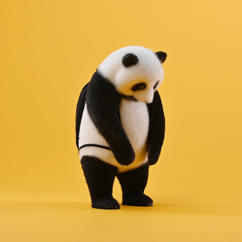 This adorable flocked panda figurine features a realistic texture, handcrafted details, and a soft-touch surface. It includes removable accessories like a bow tie, glasses, and a backpack, making it a customizable collectible. Made from high-quality resin, cloth, and metal, this panda sculpture is a perfect home decor piece or gift for panda lovers.