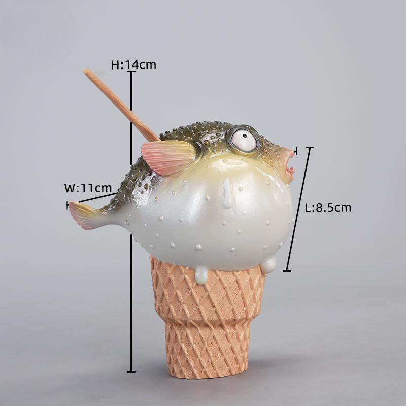 A highly detailed pufferfish ice cream figurine featuring a realistic fish with bulging eyes and textured scales, sitting on an intricately sculpted ice cream cone base. Made of premium resin, this collectible novelty item is perfect for unique decor lovers and marine life enthusiasts.