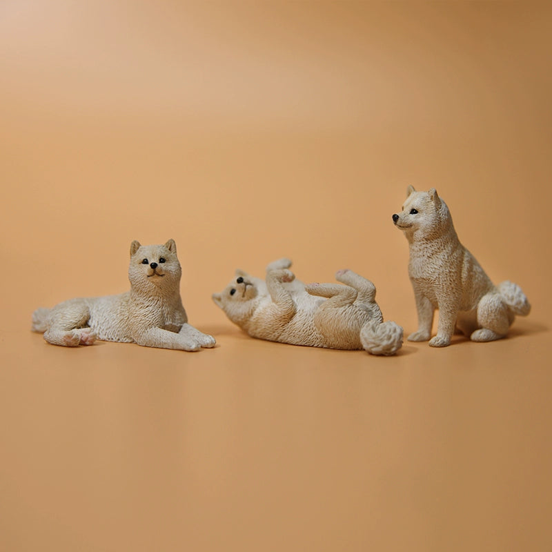 A collection of small Mini Shiba Inu and Labrador dog models showcasing various poses. The Shiba Inu models are in black and tan, while the Labrador models are black. Each model captures lifelike details, perfect for dog lovers and collectors.