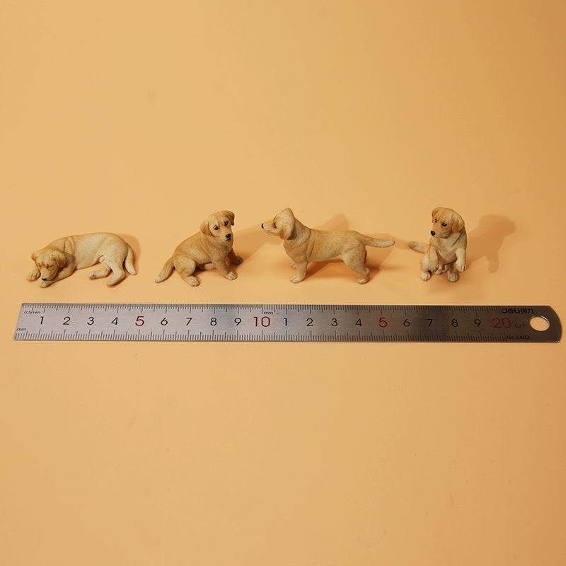 A collection of small Mini Shiba Inu and Labrador dog models showcasing various poses. The Shiba Inu models are in black and tan, while the Labrador models are black. Each model captures lifelike details, perfect for dog lovers and collectors.