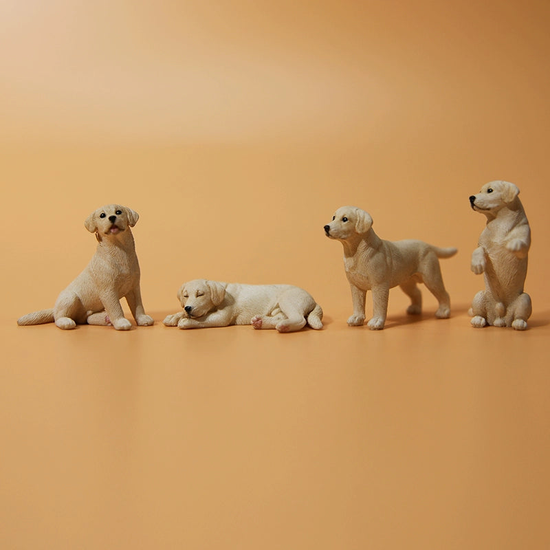 A collection of small Mini Shiba Inu and Labrador dog models showcasing various poses. The Shiba Inu models are in black and tan, while the Labrador models are black. Each model captures lifelike details, perfect for dog lovers and collectors.