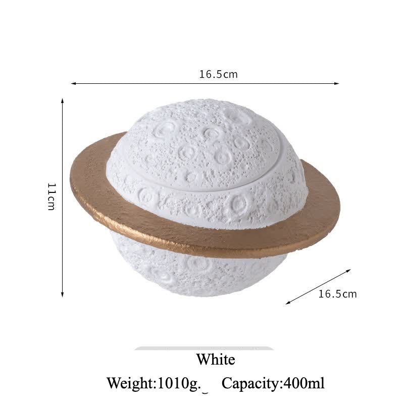 Discover the Pink Saturn-Shaped Pet Urn, a heartfelt memorial ashes holder crafted from durable Portland cement for North American pet owners. This whimsical planet-inspired design in soft pink, complete with a gold ring and textured craters, offers secure storage for up to 400ml of ashes from small pets. Measuring 16.5cm wide and 11cm tall, it weighs 1010g and fits perfectly on shelves or mantels, blending seamlessly into home decor. Ideal for cat or dog lovers seeking a unique tribute, it addresses grief 