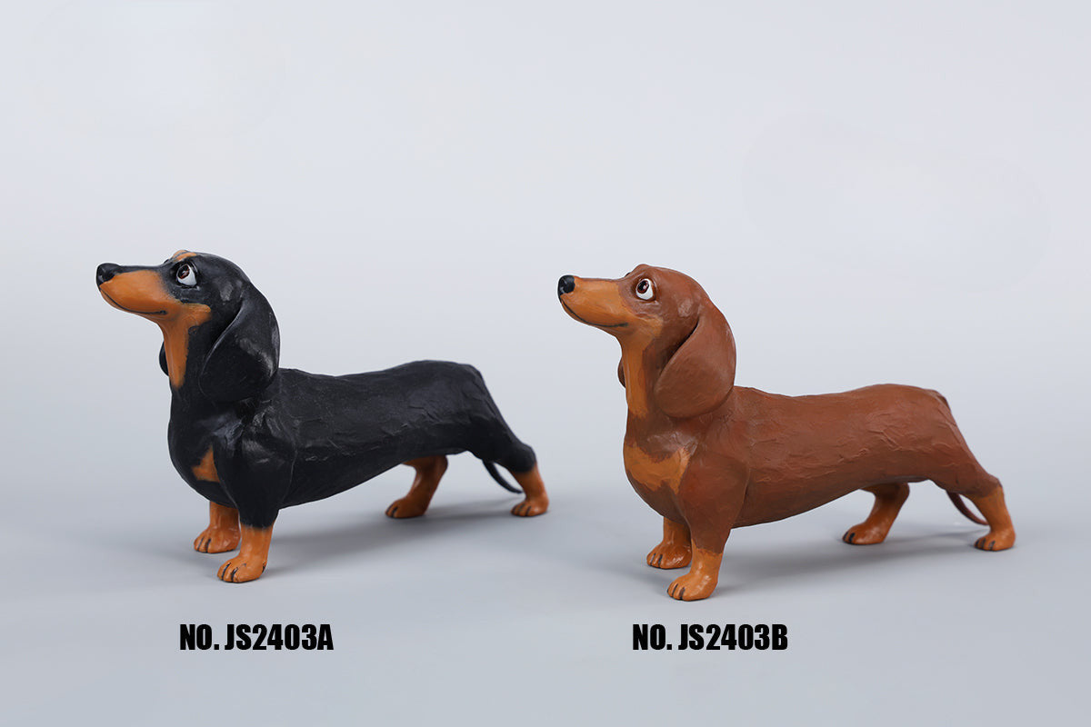 Two small clay Dachshund dog models, one black and one brown, captured in a realistic and lifelike manner. The models showcase detailed features, including expressive eyes and realistic fur textures. Perfect for collectors and dog enthusiasts.