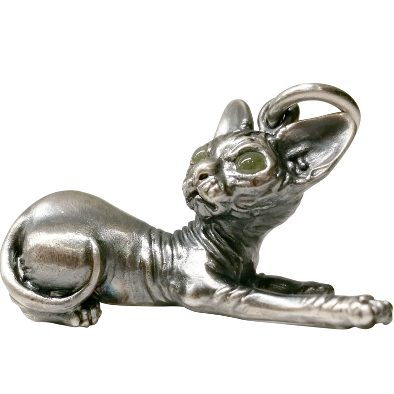 A unique Sphynx Cat Sterling Silver Pendant, handcrafted in pure 925 sterling silver with detailed carving, showcasing inlaid gemstone eyes. This customizable pendant is ideal for cat lovers and serves as a thoughtful memorial gift. Slight variations in color and size add to its authenticity.