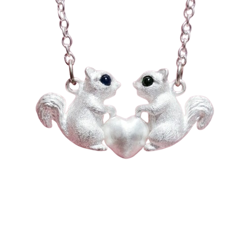 Handcrafted sterling silver squirrel pendant with gemstone eyes, featuring intricate details of a squirrel holding an apple/acorn, available in customizable eye colors. Ideal for personalized gifts and nature lovers, reflecting unique artisanal craftsmanship.