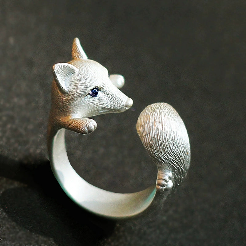 Sterling Silver Fox and Rose Ring featuring detailed fur and petal designs, with gemstone eyes in a secure bezel setting, handcrafted from solid 925 sterling silver, available in silver and antique black finishes, showcasing artisan craftsmanship and unique, customizable design.