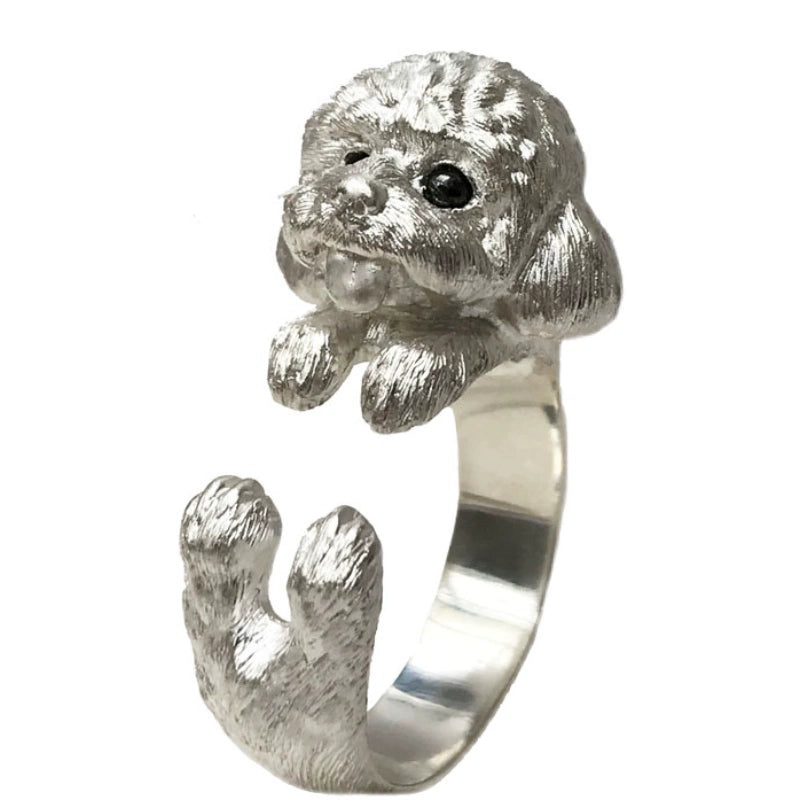 Sterling Silver Teddy Ring featuring a lifelike hand-carved puppy design, available in silver or antique black finish. The ring showcases intricate detailing with black obsidian eyes, making it a unique keepsake for pet lovers.