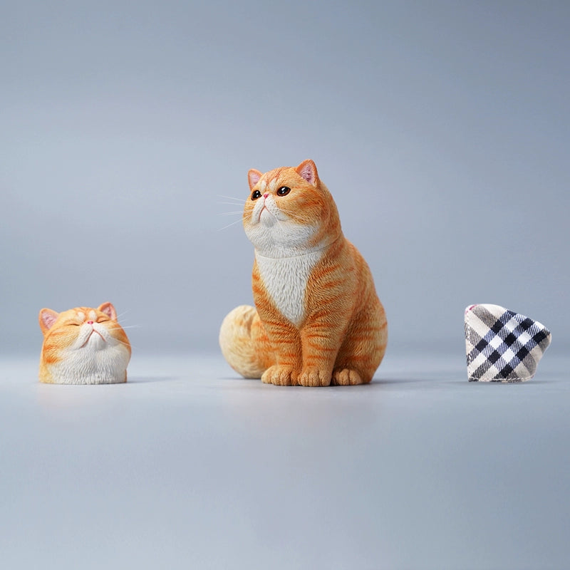 "A set of four Garfield cat resin models in different color variations, showcasing realistic fur details and changeable head designs."